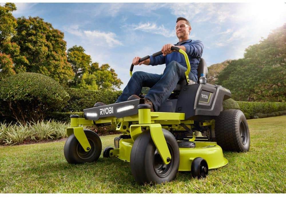 man in a riding lawn mower