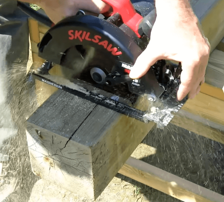 circular saw cutting a 4X4 lumber