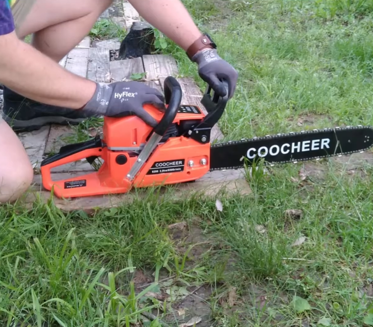 person starting a Coocheer Chainsaw