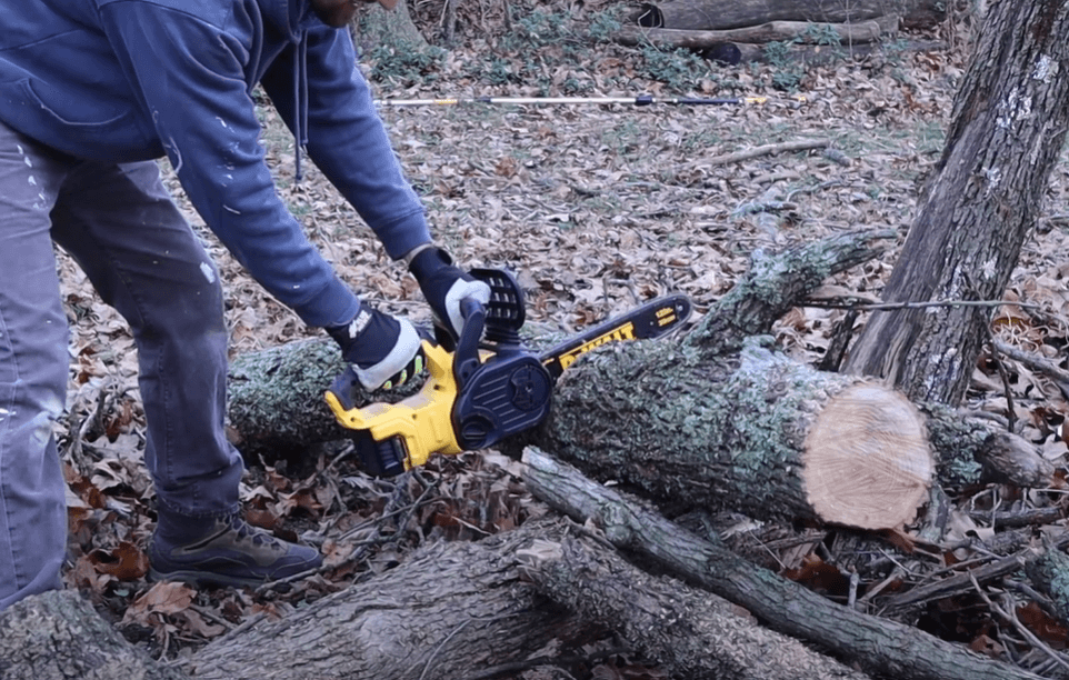 trimming log with DEWALT 20V MAX XR Chainsaw