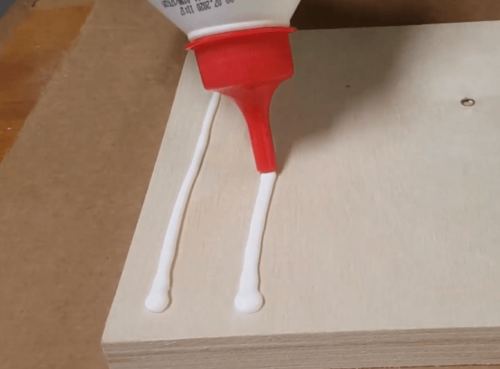 Applying PVA based glue on wood board