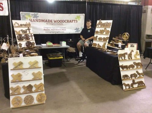 Gregory in his handmade woodcrafts sale