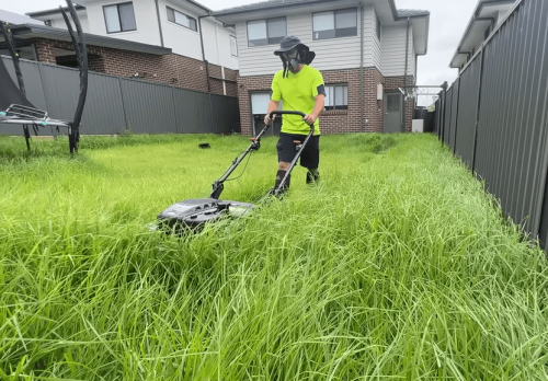 Mowing overgrown grass