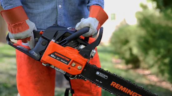 Person holding a Remington chainsaw