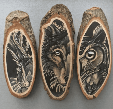 animal faces carved on wood