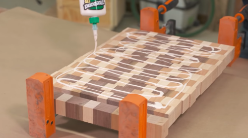 applying Titebond Premium glue to wooden board