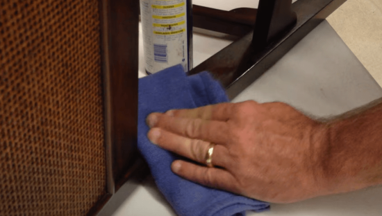 applying WD-40 on wooden furniture