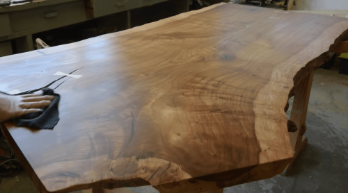 applying Wood Welded Good Stuff Wood Finish on wooden table