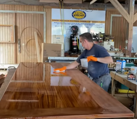 applying base coat to a wooden board