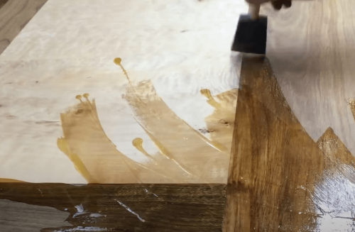 applying tung oil on maple wood