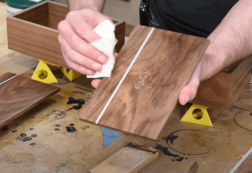 applying wax on wood