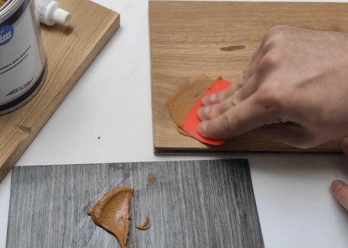 applying wood filler on plywood