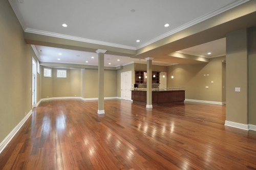 basement with hardwood flooring