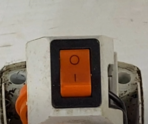 chainsaw power button