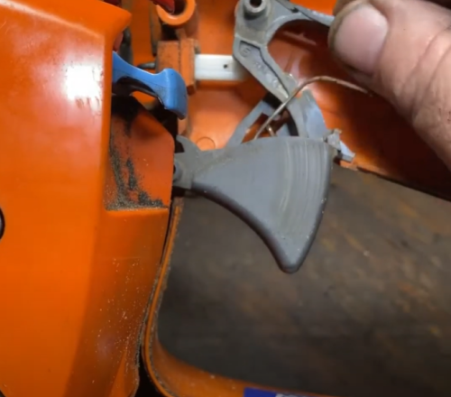 chainsaw throttle interlock