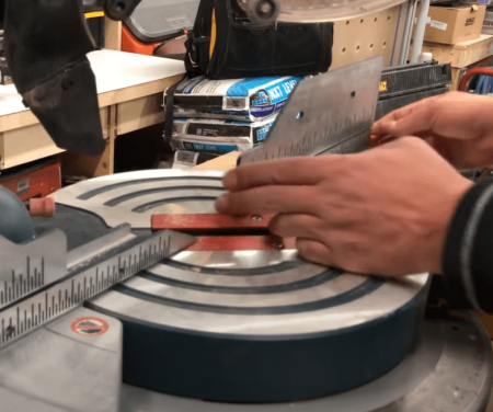 checking measurements on a miter saw