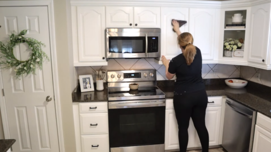cleaning kitchen cabinet