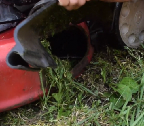 cleaning the discharge chute of lawn mower