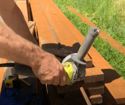 cutting a rebar with and angle grinder