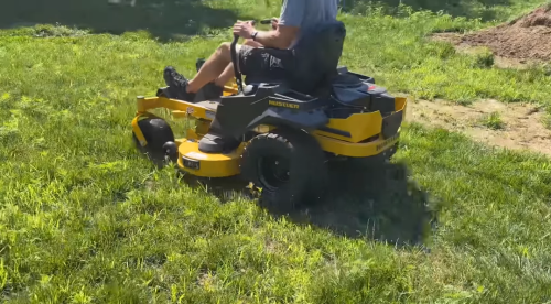 cutting grass with Hustler Mowers