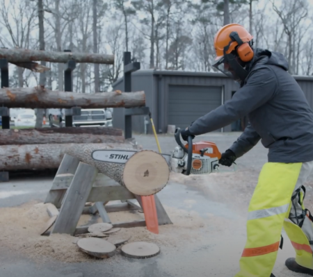 cutting log with Stihl chainsaw