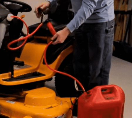 filling the fuel tank of a riding mower