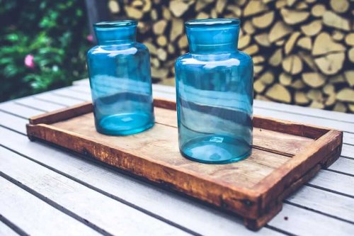 glass jars on a wooden tray