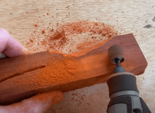 handling dremel tool on wood