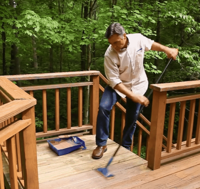 man cleaning deck