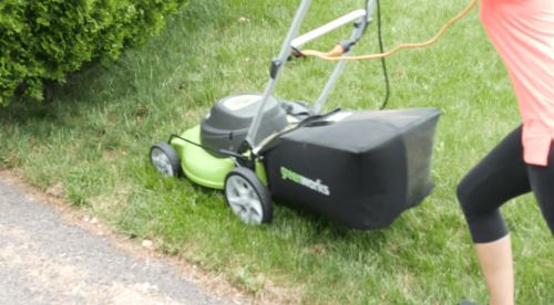 mowing with Greenworks 25022