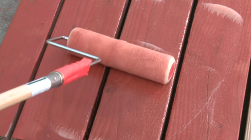 painting deck with paint roller