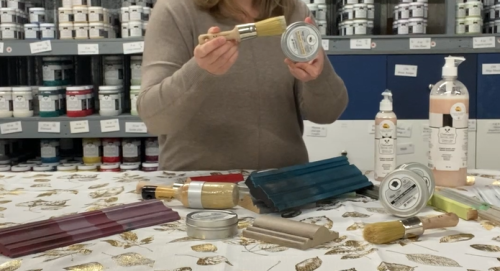 person holding a Colorantic Round Wax Brush