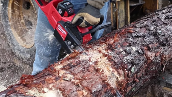 person operating Milwaukee M18 Chainsaw