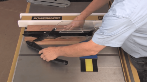 person operating a table saw