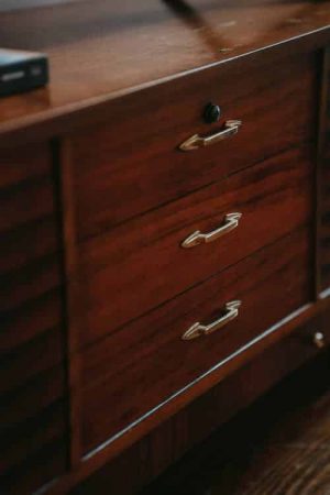 wooden drawers with iron handles