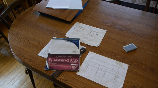 planning pad and papers on wooden table