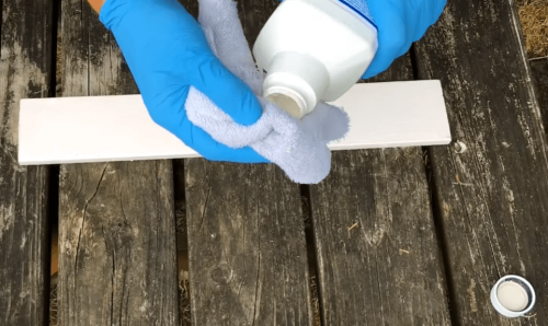 pouring liquid sandpaper to cloth