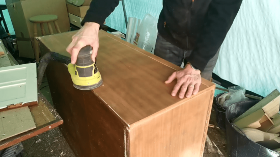 sanding an old cabinet