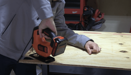 sawing wood board with BLACK+DECKER 20V MAX