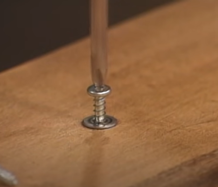 screw in wooden board