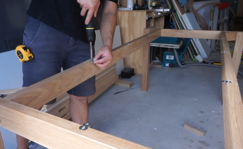 screwing the side of wood table