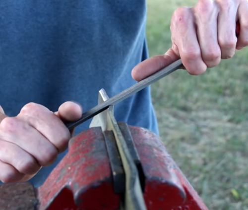 sharpening mower blade with file