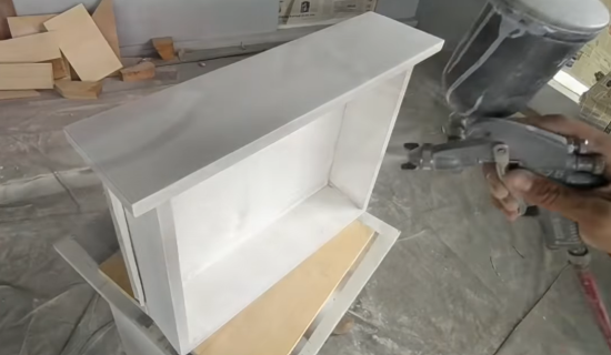 spray painting cabinet drawer with enamel paint