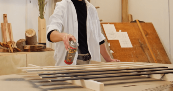 spraying flex seal on woodworking project