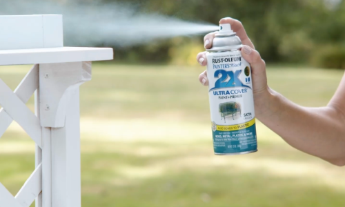 spraying primer on a bench