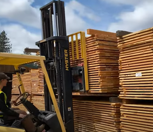 stacking lumber from the mill