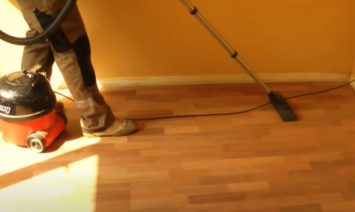 vacuuming sanded floor