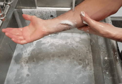 washing hands with soapy water